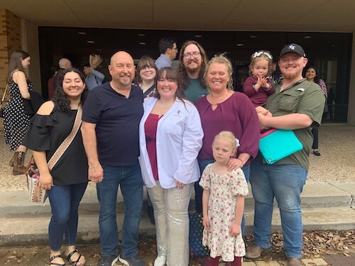 Dr. Dakota Mitchell with her family at her white coat ceremony — Amarillo, TX