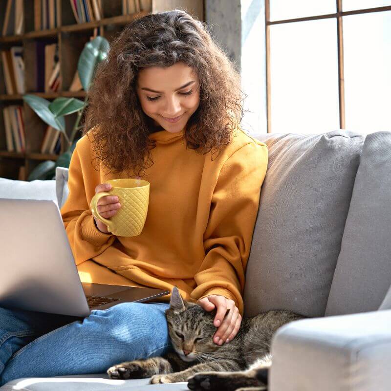 woman-relaxing-petting-cat